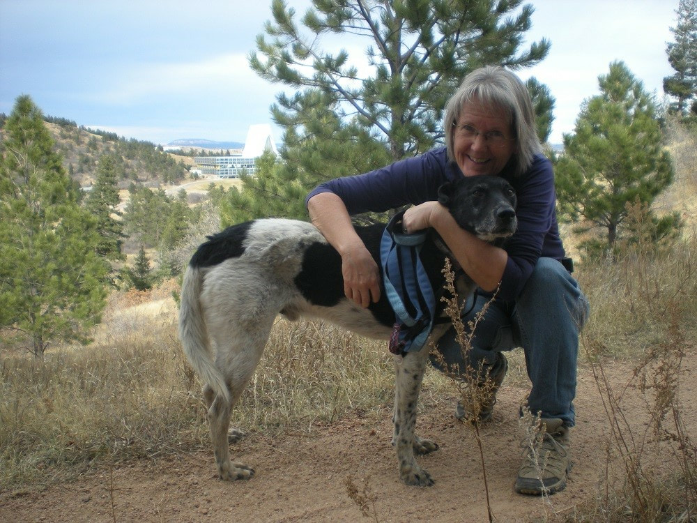 Ellen and Roscoe on a mountain trail Happy Dogs CBD